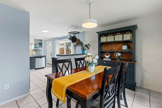 32 Powder Horn Pl, Longmont, CO 80504 - dining space with light tile patterned flooring and wooden walls