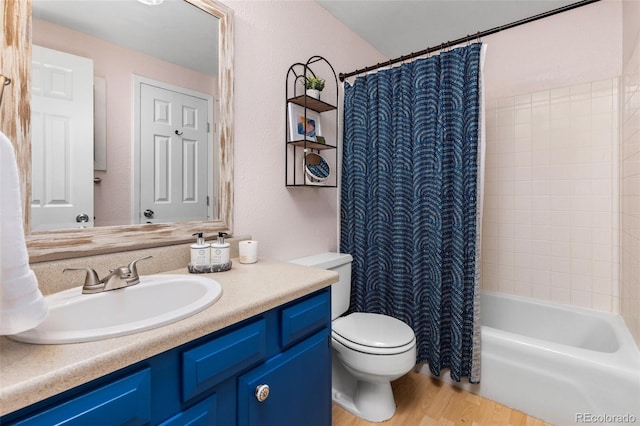 32 Powder Horn Pl, Longmont, CO 80504 - bathroom with vanity, wood finished floors, and shower / bath combination with curtain