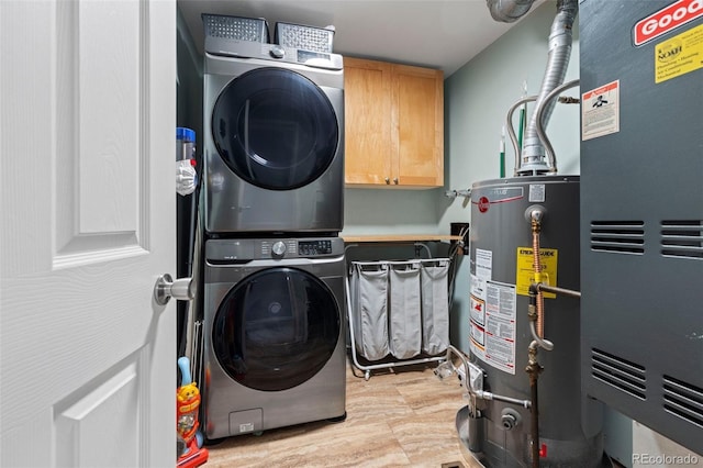 32 Powder Horn Pl, Longmont, CO 80504 - laundry room with water heater, stacked washing machine and dryer, heating unit, and cabinet space