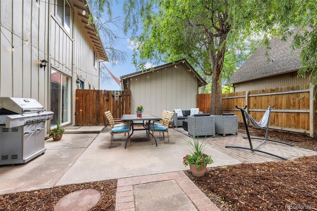 32 Powder Horn Pl, Longmont, CO 80504 - fenced backyard featuring area for grilling, outdoor lounge area, a patio area, and outdoor dining area