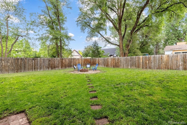 32 Powder Horn Pl, Longmont, CO 80504 - fenced backyard with a fire pit
