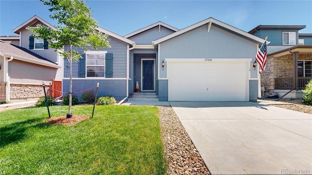 17114 Elati St, Broomfield, CO 80023 - view of front of house featuring an attached garage, a front lawn, and concrete driveway