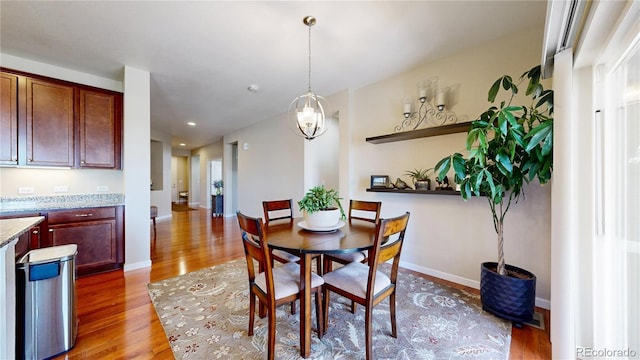 17114 Elati St, Broomfield, CO 80023 - dining space with light wood finished floors and recessed lighting