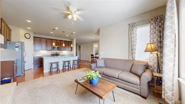 17114 Elati St, Broomfield, CO 80023 - living area with ceiling fan, recessed lighting, and light wood-type flooring