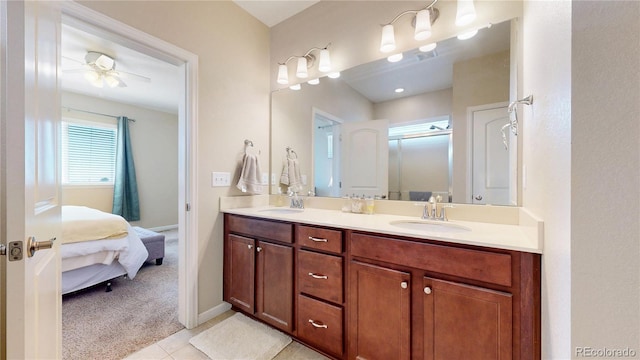 17114 Elati St, Broomfield, CO 80023 - full bathroom featuring connected bathroom, double vanity, tile patterned flooring, a shower with shower door, and a ceiling fan