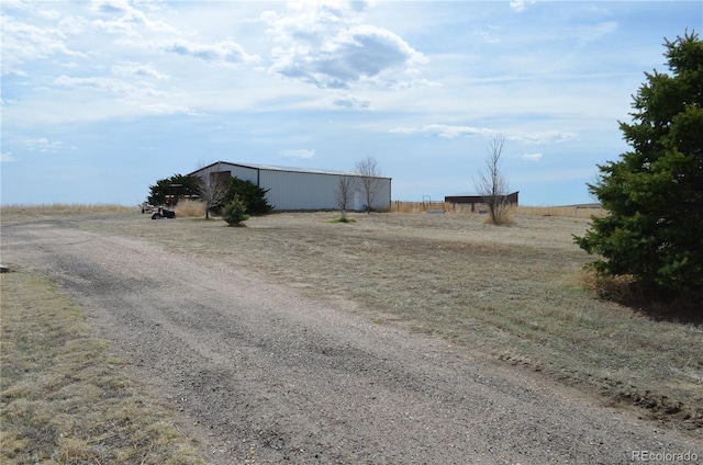 74500 E 136th Ave, Byers, CO 80103 - view of yard featuring an outbuilding and a rural view