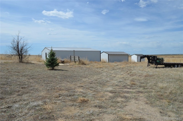 74500 E 136th Ave, Byers, CO 80103 - view of yard featuring an outbuilding and an outdoor structure