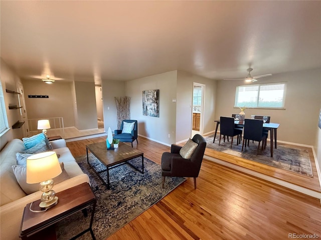 6272 S Garfield Dr, Centennial, CO 80121 - living area with wood finished floors, baseboards, and ceiling fan