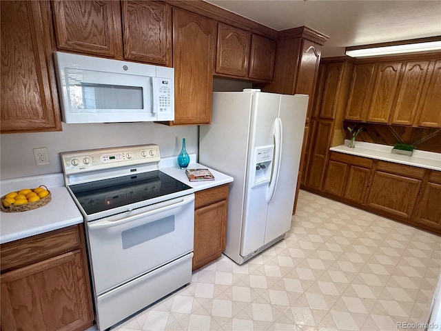 6272 S Garfield Dr, Centennial, CO 80121 - kitchen with white appliances, light flooring, and light countertops