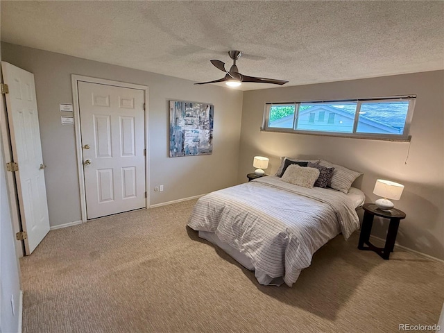 6272 S Garfield Dr, Centennial, CO 80121 - bedroom with baseboards, carpet flooring, ceiling fan, and a textured ceiling