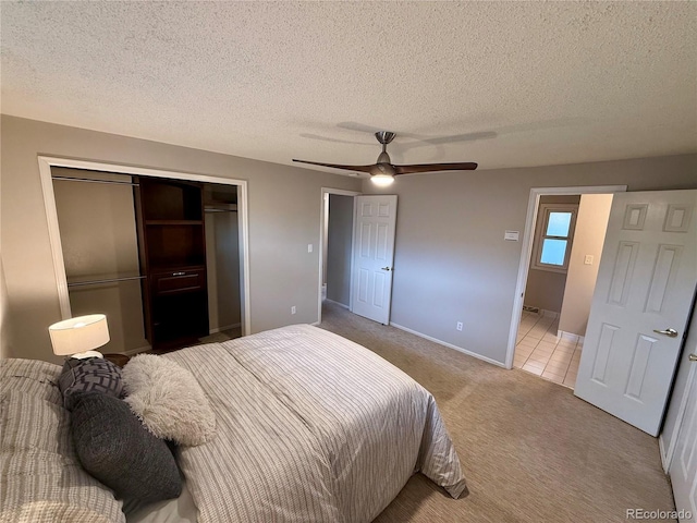 6272 S Garfield Dr, Centennial, CO 80121 - carpeted bedroom featuring a closet, a textured ceiling, ceiling fan, and baseboards