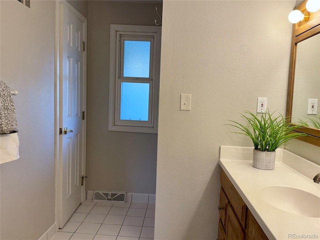 6272 S Garfield Dr, Centennial, CO 80121 - bathroom with vanity, tile patterned floors, and baseboards
