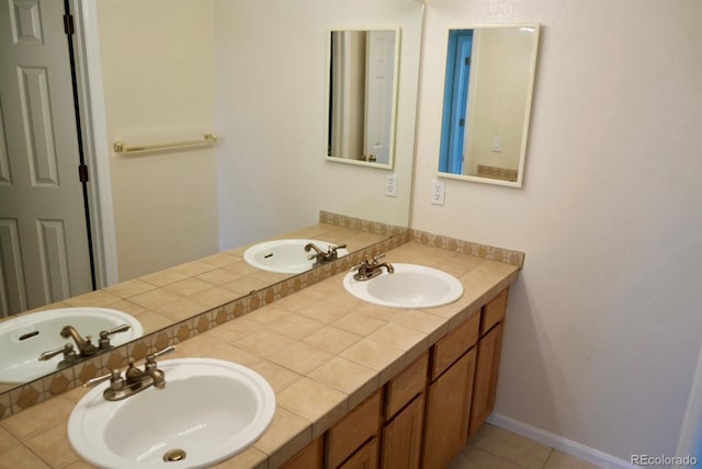 full bath featuring double vanity and a sink