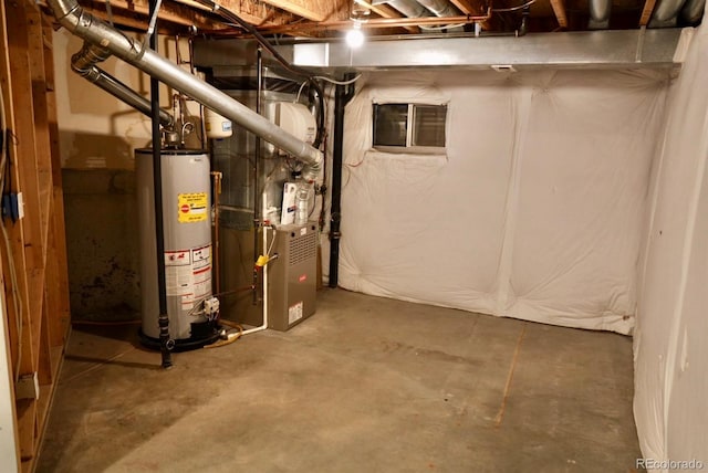 unfinished basement featuring heating unit and gas water heater