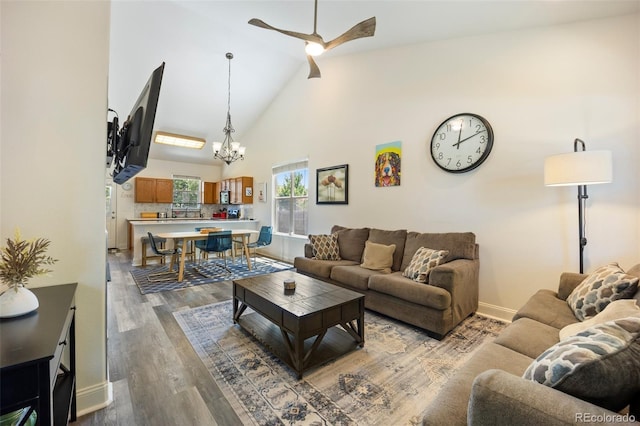 1884 Asoka St, Strasburg, CO 80136 - living room featuring a ceiling fan, a chandelier, wood finished floors, and high vaulted ceiling