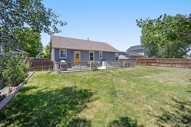 1884 Asoka St, Strasburg, CO 80136 - rear view of house with a fenced backyard