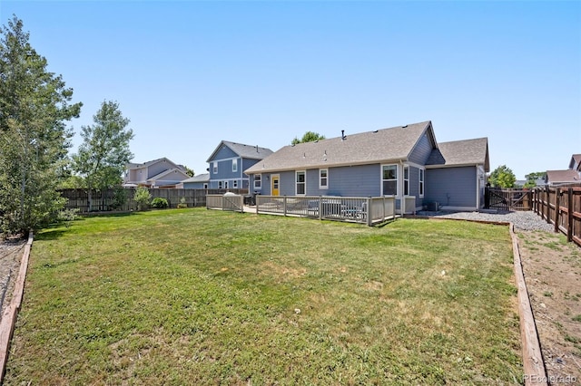 1884 Asoka St, Strasburg, CO 80136 - rear view of house featuring a fenced backyard and a patio