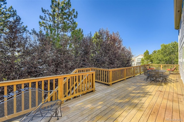 7855 Arundel Ln, Lone Tree, CO 80124 - wooden deck featuring outdoor dining space