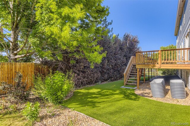 7855 Arundel Ln, Lone Tree, CO 80124 - view of yard featuring stairway and a wooden deck