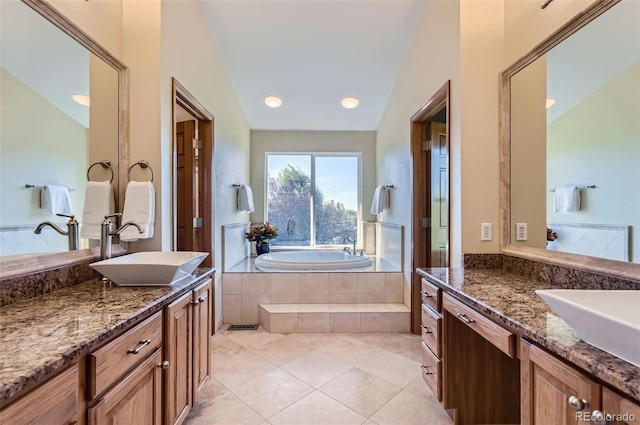 7855 Arundel Ln, Lone Tree, CO 80124 - bathroom featuring a bath, two vanities, and tile patterned floors