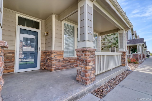 property entrance with covered porch