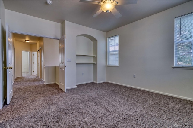 spare room featuring carpet flooring and ceiling fan