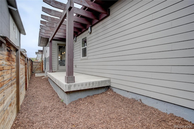 view of side of home featuring a pergola