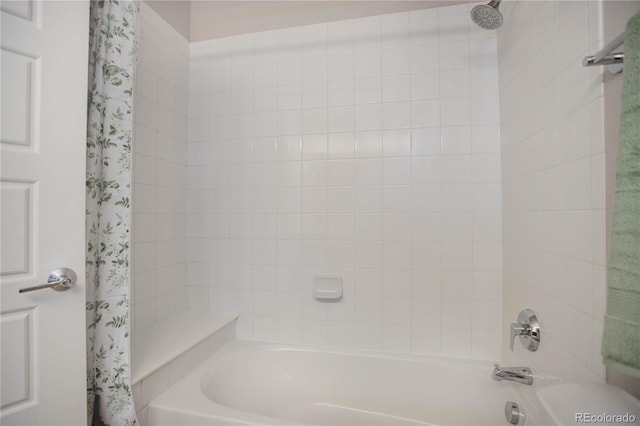 bathroom with shower / bath combination with curtain