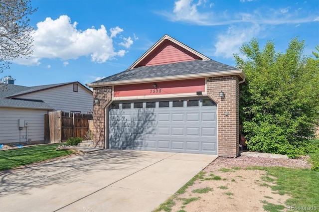 7598 Jared Way, Littleton, CO 80125 - garage featuring fence and concrete driveway
