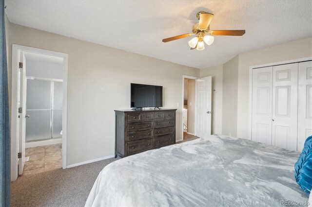 7598 Jared Way, Littleton, CO 80125 - carpeted bedroom with a closet, baseboards, and ceiling fan