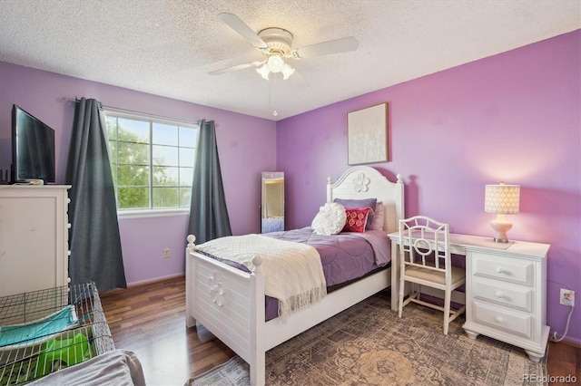 7598 Jared Way, Littleton, CO 80125 - bedroom featuring wood finished floors, a textured ceiling, and ceiling fan
