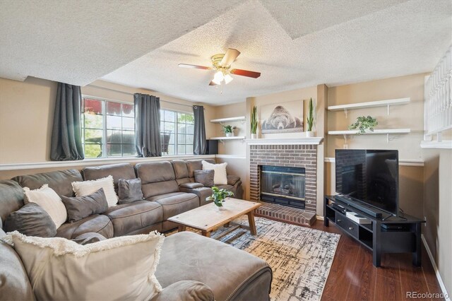 7598 Jared Way, Littleton, CO 80125 - living room with ceiling fan, a textured ceiling, a fireplace, wood finished floors, and baseboards