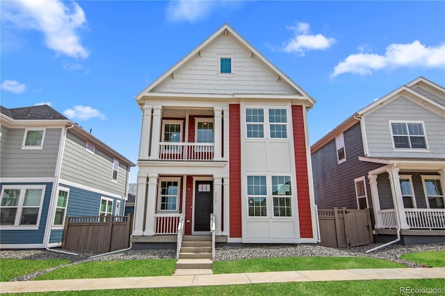 213 Washington St, Erie, CO 80516 - view of front of home featuring fence, a porch, and a balcony
