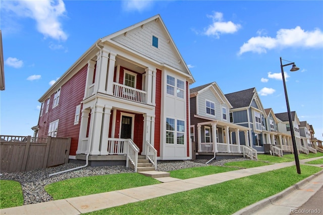 213 Washington St, Erie, CO 80516 - view of front of home with a residential view, covered porch, and a balcony