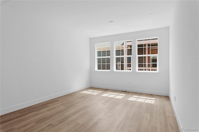 213 Washington St, Erie, CO 80516 - spare room with light wood-style flooring and baseboards
