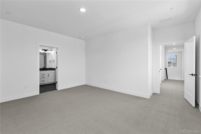 213 Washington St, Erie, CO 80516 - unfurnished bedroom featuring carpet, baseboards, recessed lighting, and ensuite bath