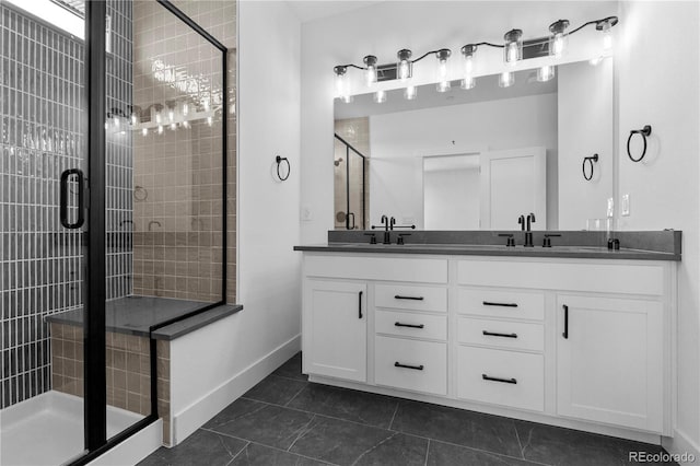 213 Washington St, Erie, CO 80516 - full bath featuring a stall shower, double vanity, baseboards, and tile patterned flooring