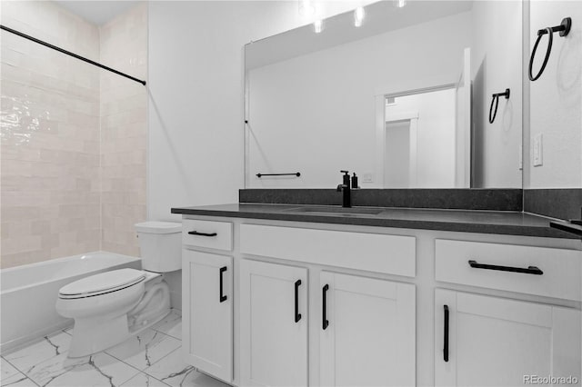 213 Washington St, Erie, CO 80516 - full bathroom with toilet, vanity, marble finish floors, and bathtub / shower combination