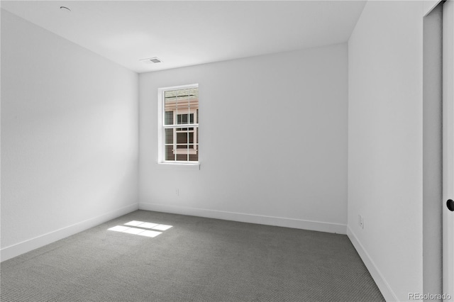 213 Washington St, Erie, CO 80516 - empty room featuring carpet and baseboards
