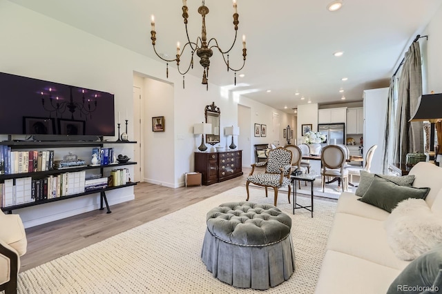 15919 Xanthia Way, Thornton, CO 80602 - living area featuring light wood-style floors, a chandelier, recessed lighting, and baseboards