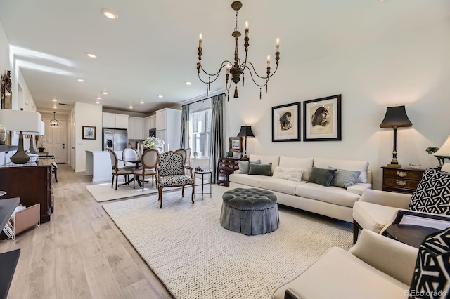 15919 Xanthia Way, Thornton, CO 80602 - living area featuring light wood finished floors, a chandelier, and recessed lighting