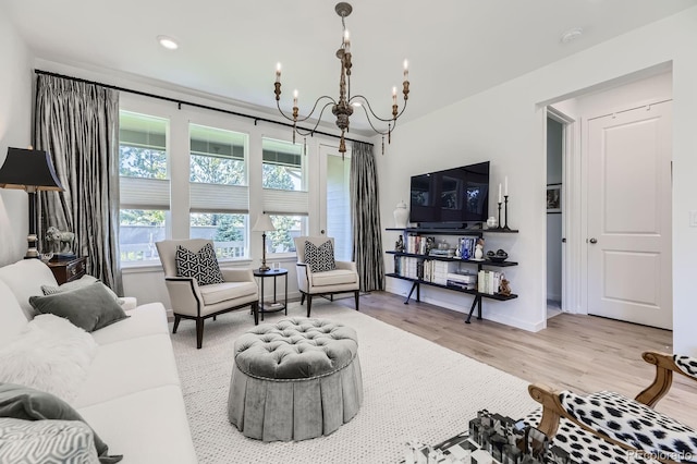 15919 Xanthia Way, Thornton, CO 80602 - living room featuring a chandelier, wood finished floors, recessed lighting, and baseboards