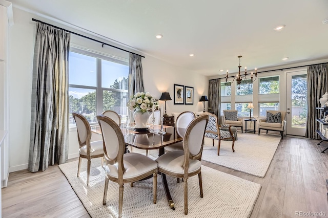 15919 Xanthia Way, Thornton, CO 80602 - dining space featuring a chandelier, light wood finished floors, recessed lighting, and baseboards
