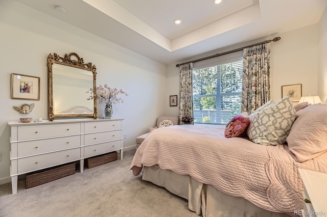 15919 Xanthia Way, Thornton, CO 80602 - bedroom featuring light colored carpet, recessed lighting, a tray ceiling, and baseboards
