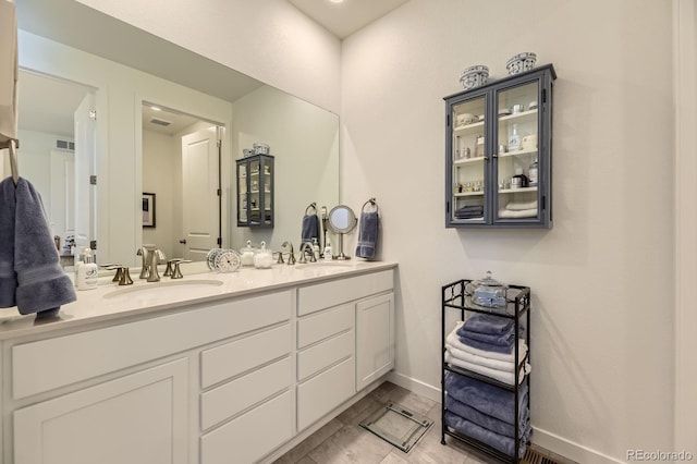 15919 Xanthia Way, Thornton, CO 80602 - bathroom with double vanity and baseboards
