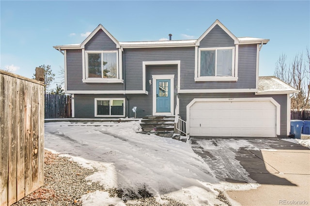 split foyer home featuring a garage