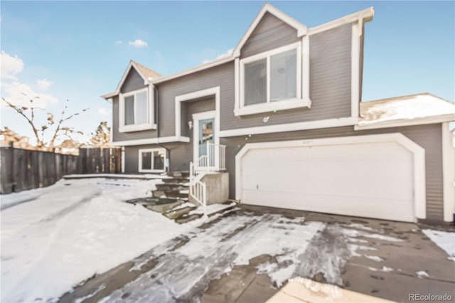 18971 E Mercer Dr, Aurora, CO 80013 - bi-level home featuring a garage and driveway