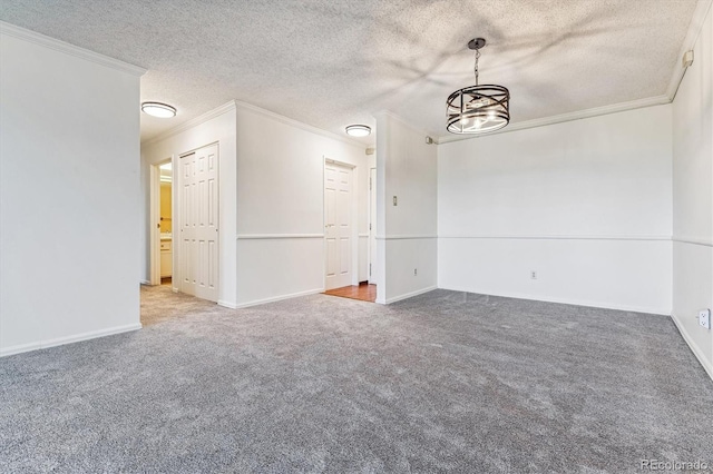 carpeted empty room with ornamental molding, an inviting chandelier, and a textured ceiling