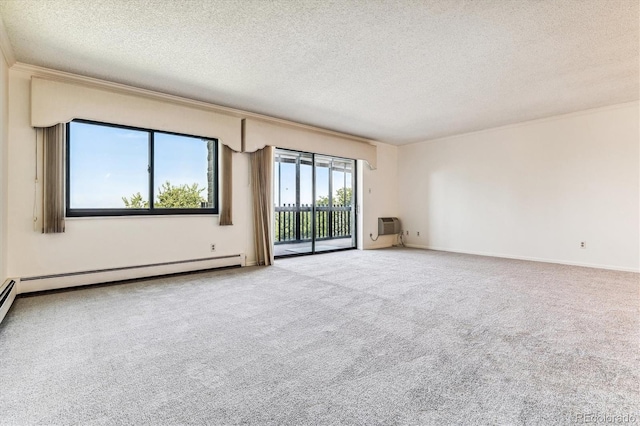 carpeted empty room with ornamental molding, a textured ceiling, and baseboard heating