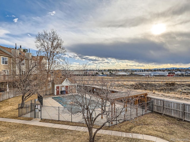 pool featuring a residential view, a patio area, and a fenced backyard